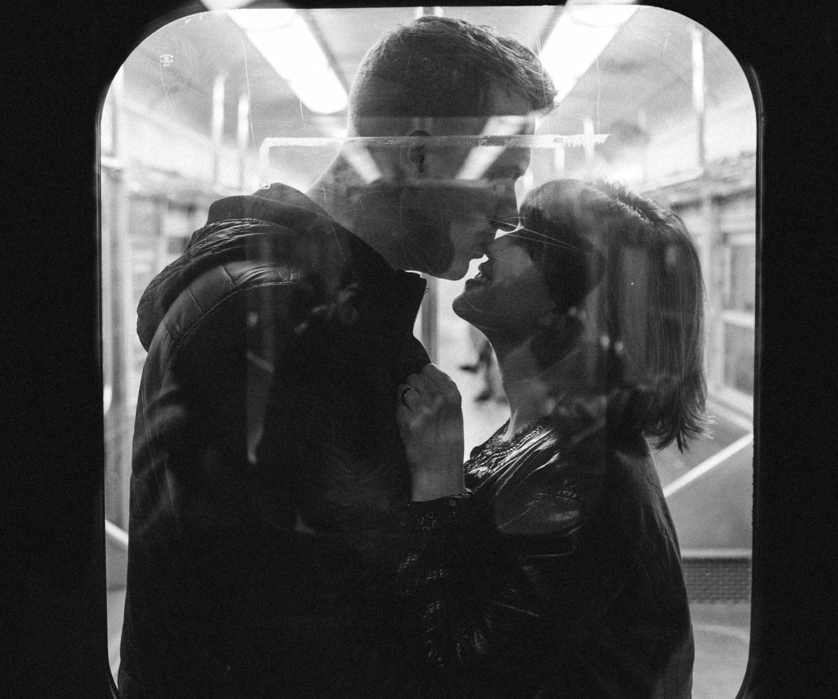 Couple therapy clients embracing in a Utah train.