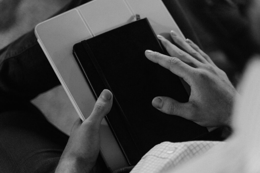 Therapist learning new material with notebook in hand.