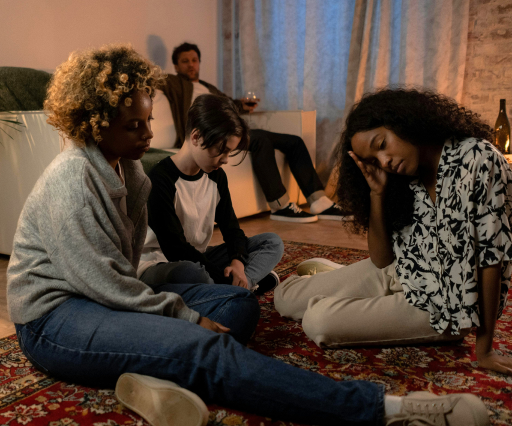 Sad family in a living room.