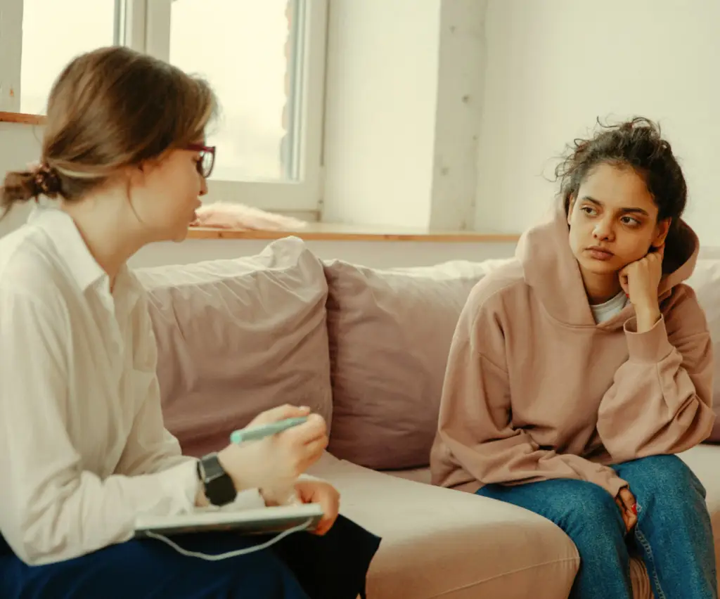 Therapist speaking to client in distress.