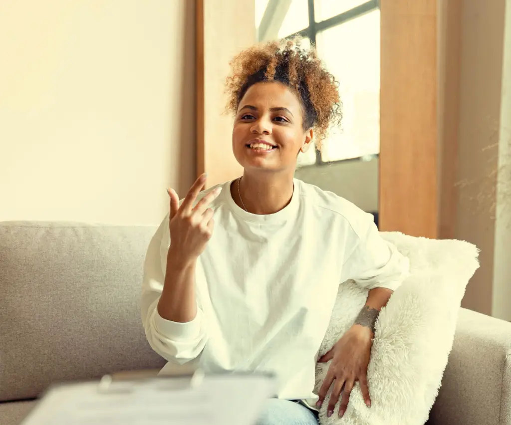 Happy woman talking to someone.