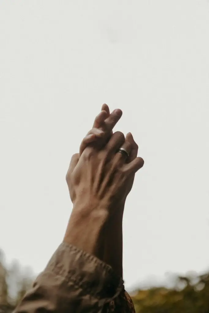 Hands intertwined in the sky.